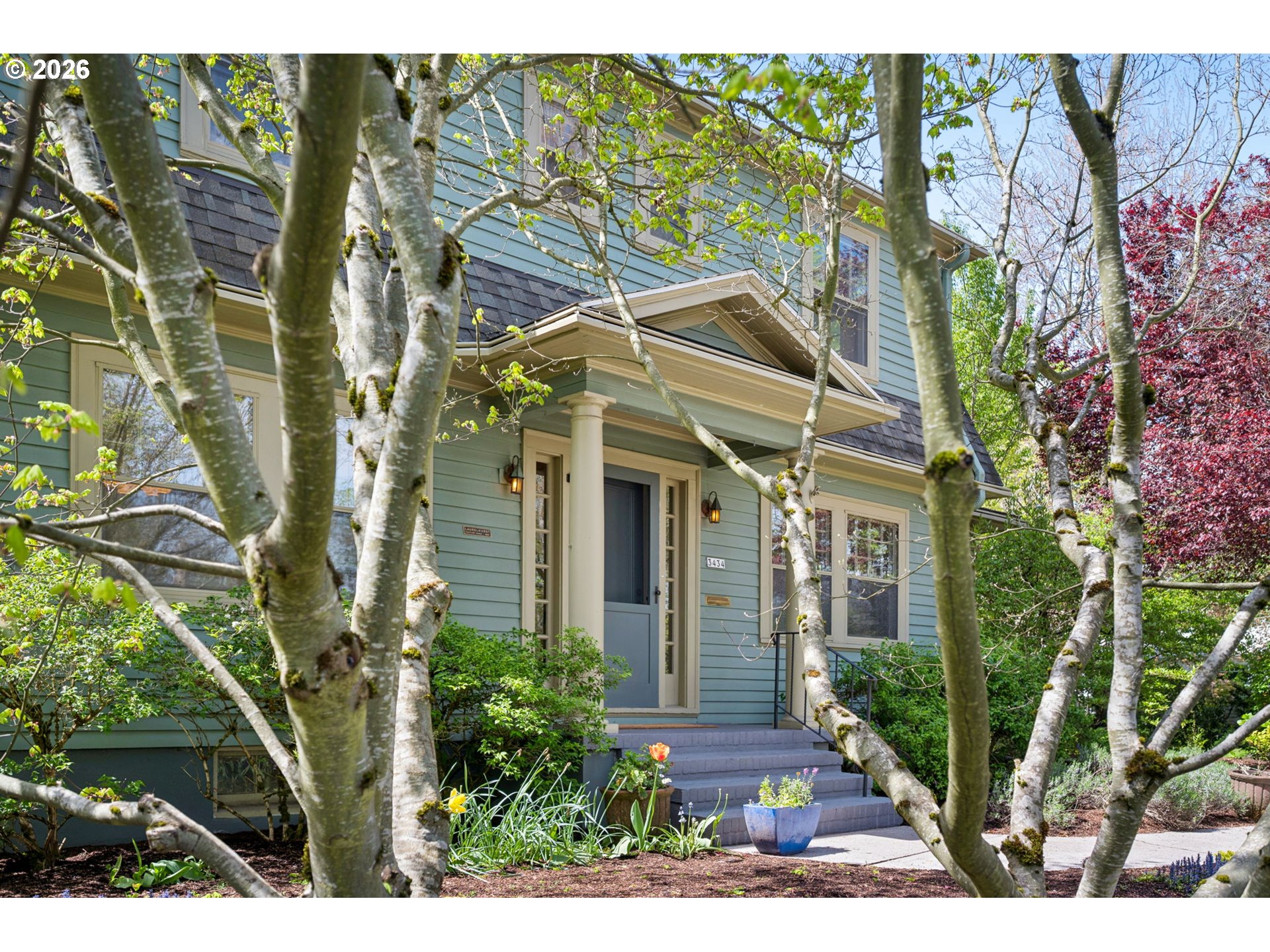 3434 Northeast Peerless Place Portland, OR 97232 - Photo 5 of 40 a view of a house with a tree