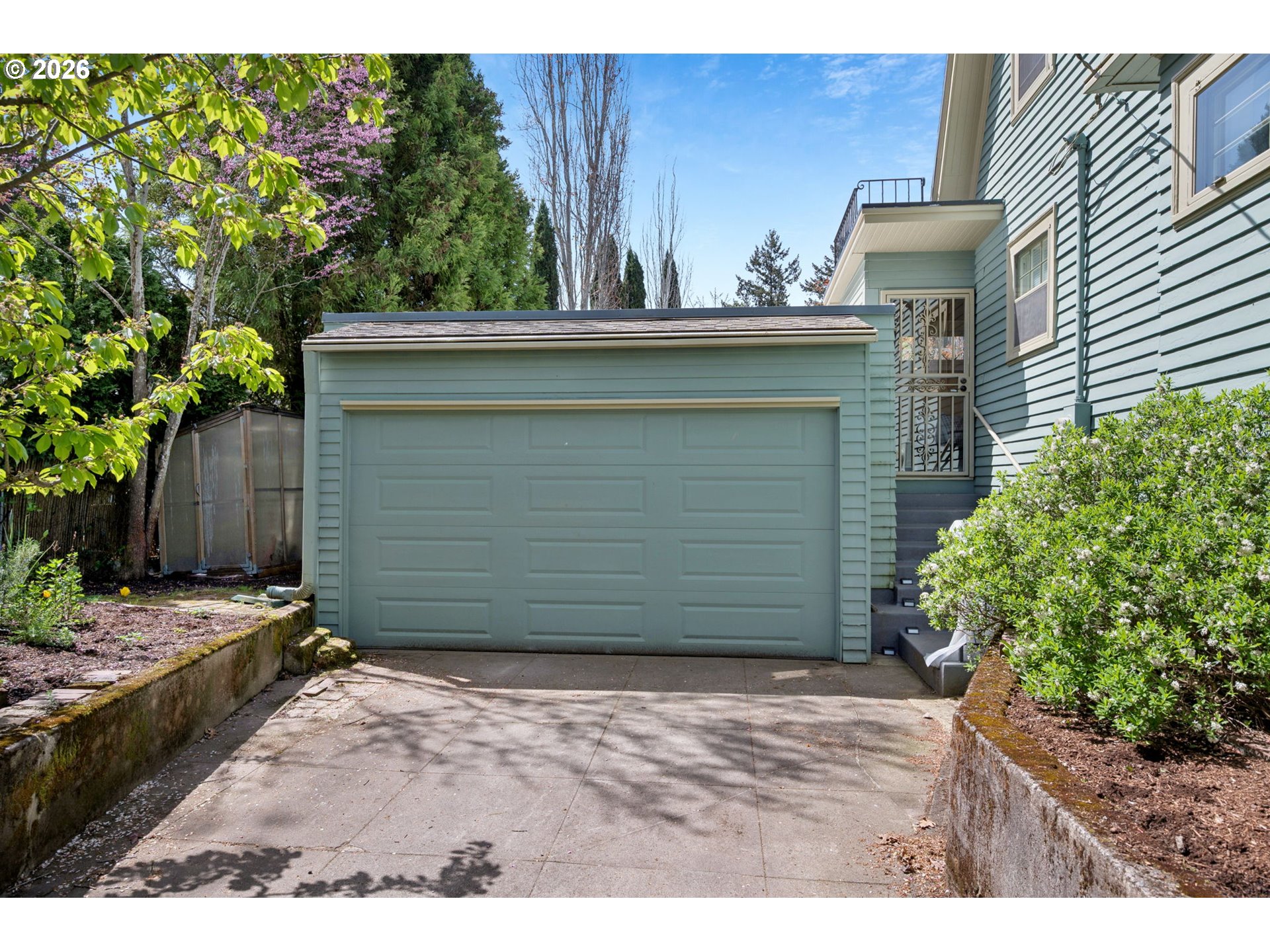 3434 Northeast Peerless Place Portland, OR 97232 - Photo 6 of 40 a view of a house with a yard and garage