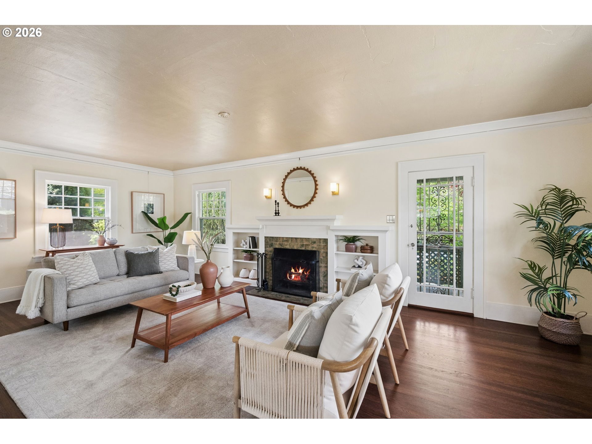 3434 Northeast Peerless Place Portland, OR 97232 - Photo 8 of 40 a living room with furniture a fireplace and wooden floor