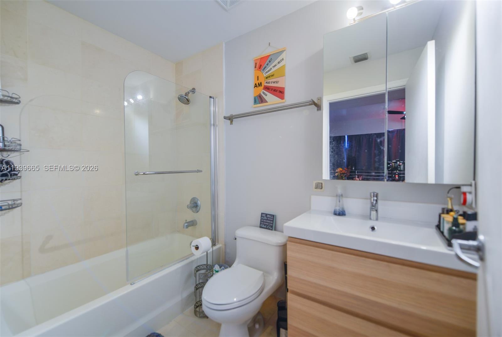 60 Southwest 13th Street, Unit 2404 Miami, FL 33130 - Photo 12 of 28 a bathroom with a sink a toilet and shower
