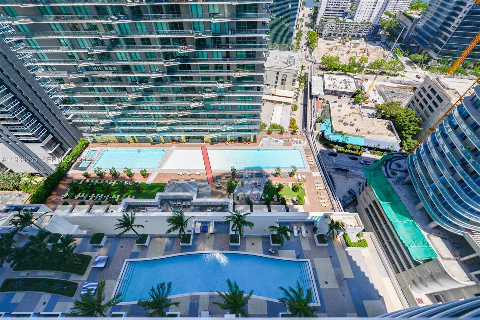 60 Southwest 13th Street, Unit 2404 Miami, FL 33130 - Photo 18 of 28 a view of swimming pool with outdoor seating