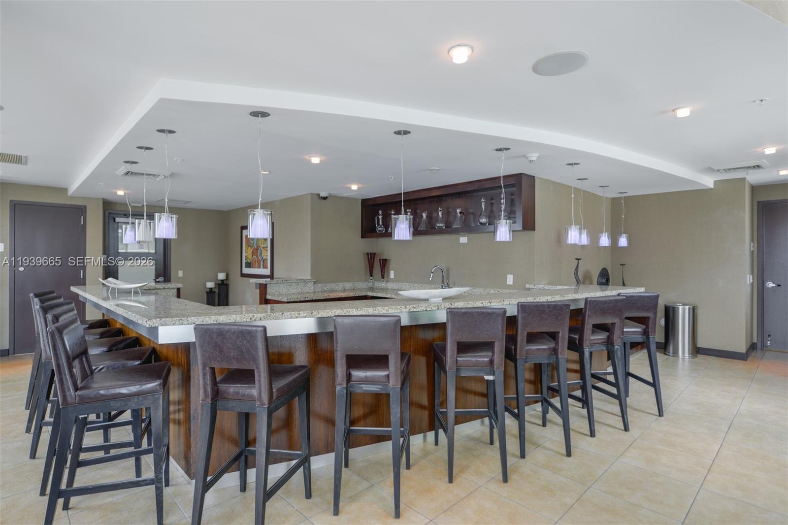 60 Southwest 13th Street, Unit 2404 Miami, FL 33130 - Photo 22 of 28 a kitchen with a dining table chairs and large window