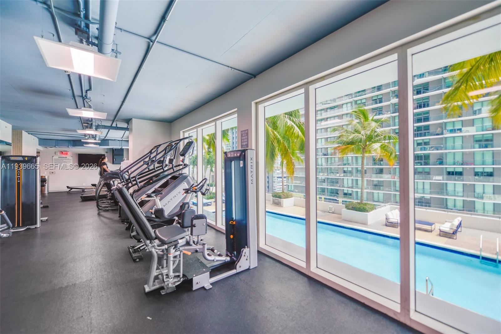 60 Southwest 13th Street, Unit 2404 Miami, FL 33130 - Photo 26 of 28 a view of a room with gym equipment