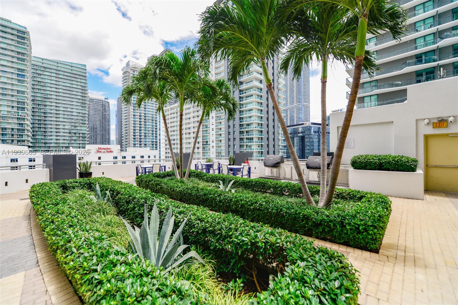 60 Southwest 13th Street, Unit 2404 Miami, FL 33130 - Photo 28 of 28 a front view of a house with garden and plants