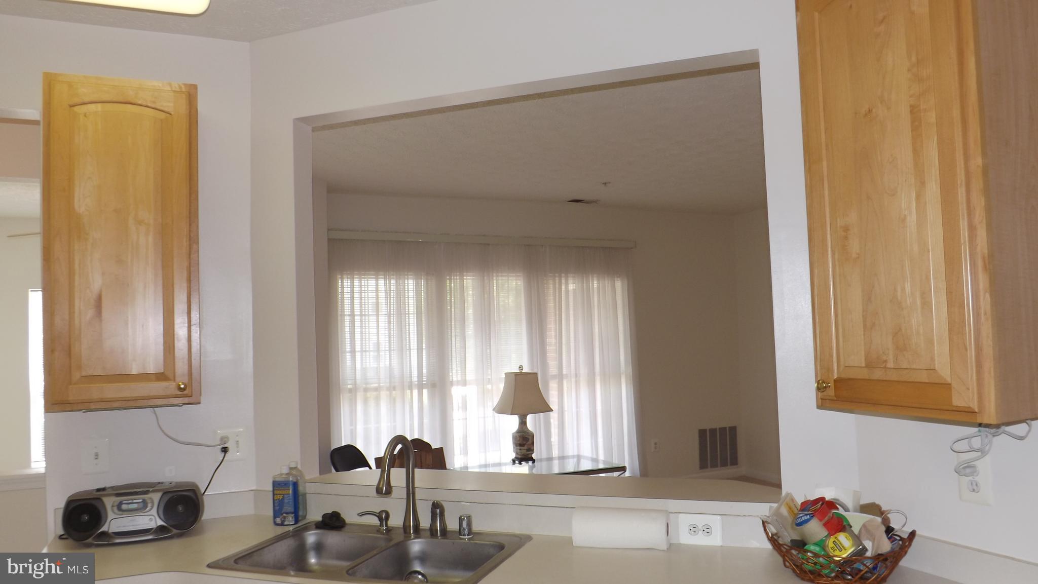 5218 Millfield Road, Unit 5218 Baltimore, MD 21237 - Photo 6 of 14 Kitchen Pass Through Looking into Living Room