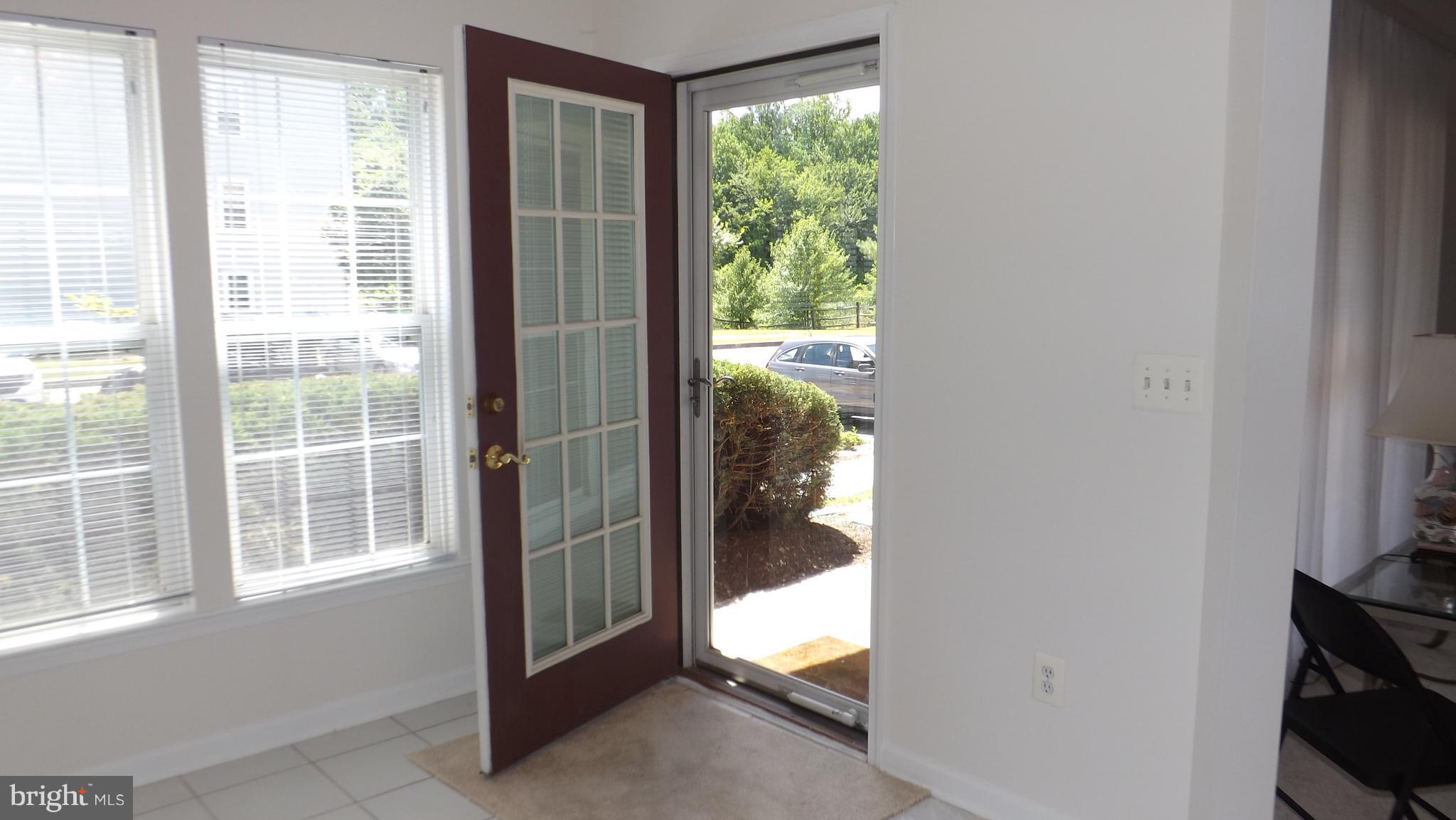5218 Millfield Road, Unit 5218 Baltimore, MD 21237 - Photo 8 of 14 Sun Room with Door to Outside