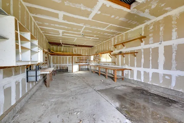 a view of an empty room with windows