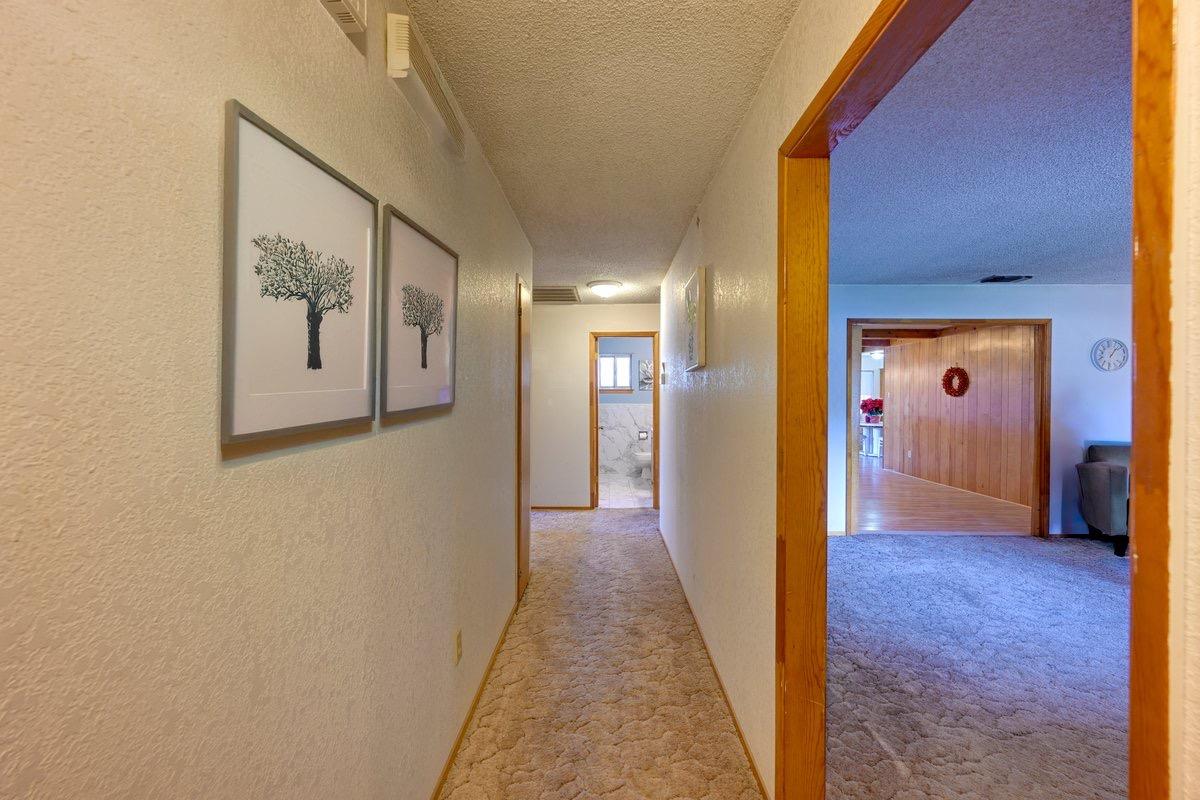 3421 County Road 88C Dunnigan, CA 95937 - Photo 5 of 22 a view of a hallway with wooden shelves