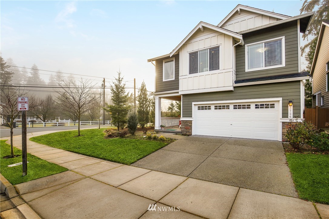 3726 198th Place Southeast Bothell, WA 98012 - Photo 1 of 1 a view of a white house next to a yard and trees