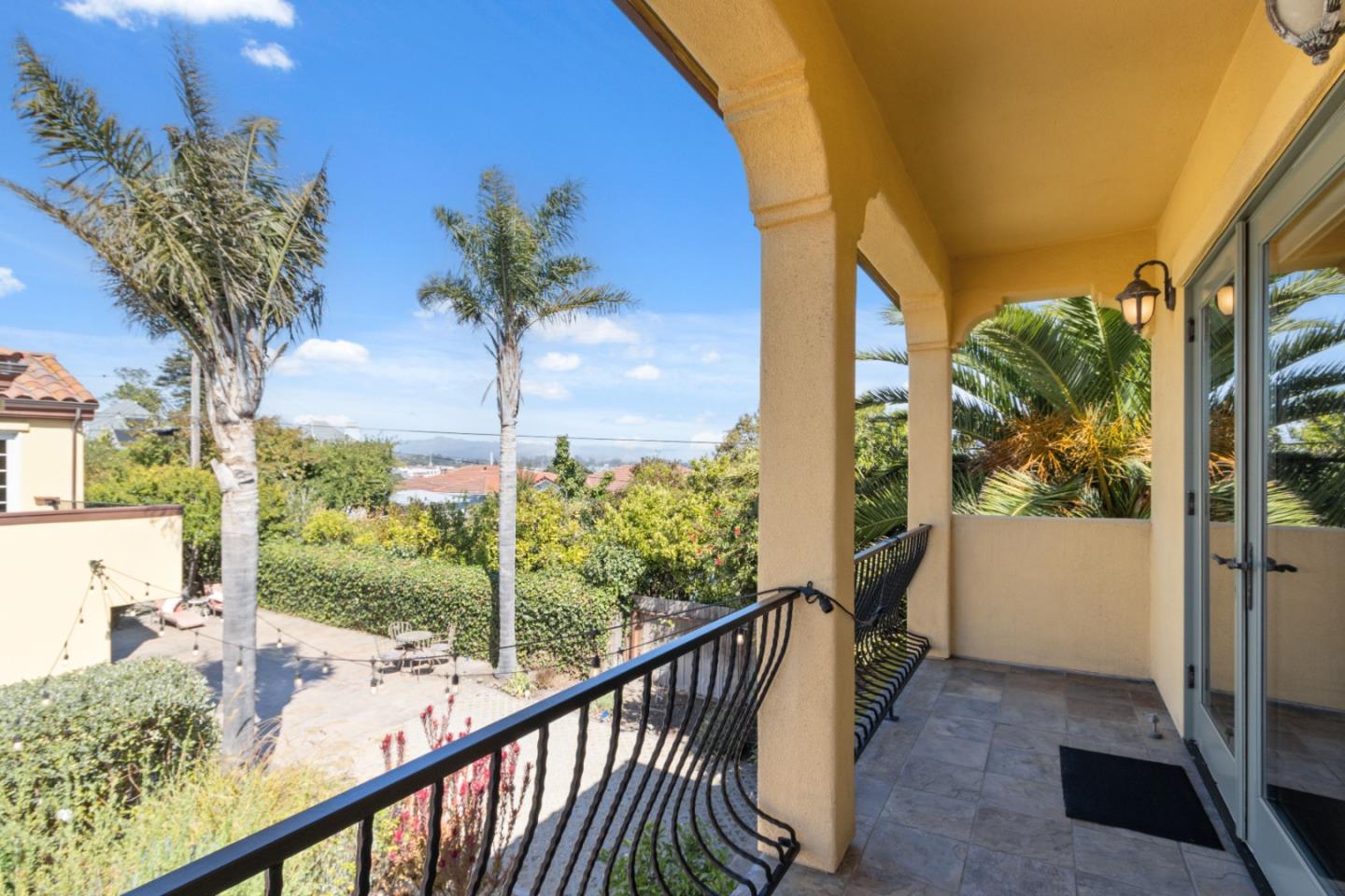 116 Monterey Street Santa Cruz, CA 95060 - Photo 42 of 61 a view of a porch with a floor to ceiling window next to a yard