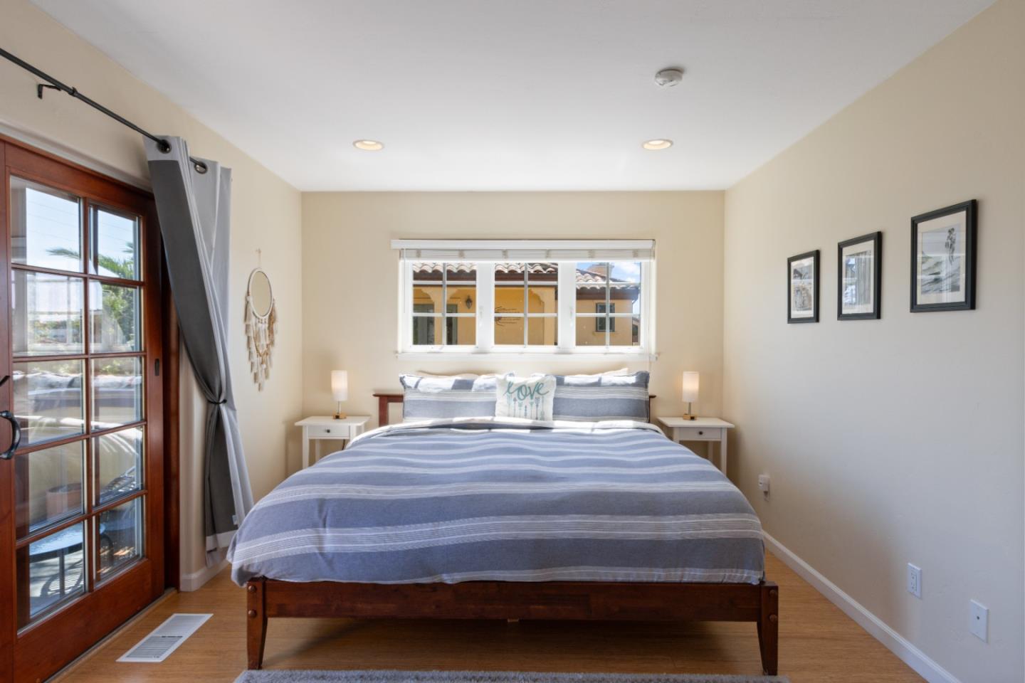 116 Monterey Street Santa Cruz, CA 95060 - Photo 47 of 61 a bedroom with a bed wooden floor and window