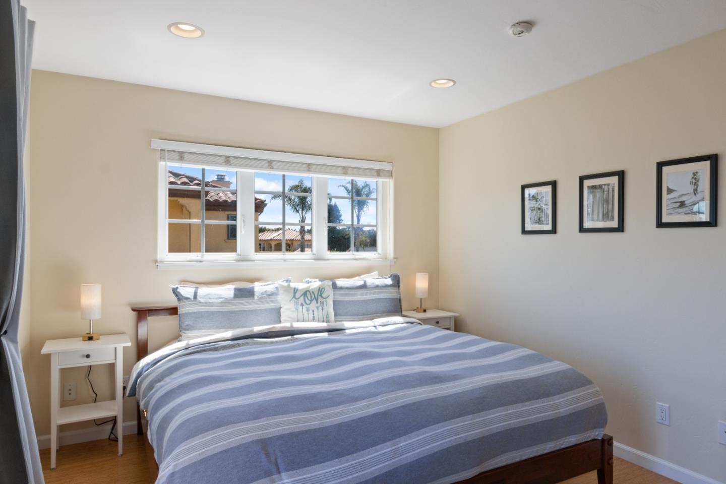 116 Monterey Street Santa Cruz, CA 95060 - Photo 48 of 61 a bedroom with a bed and wooden floor