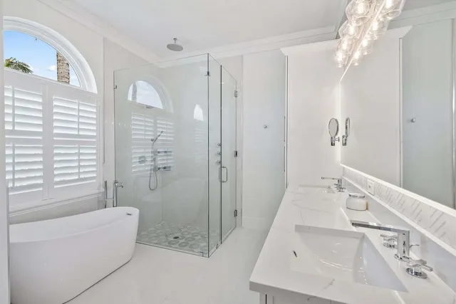 a bathroom with a bathtub and a shower