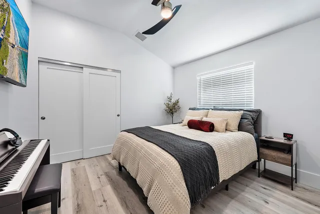 a bedroom with a bed and a dresser