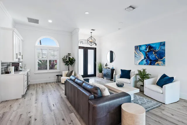 a living room with furniture fireplace and window