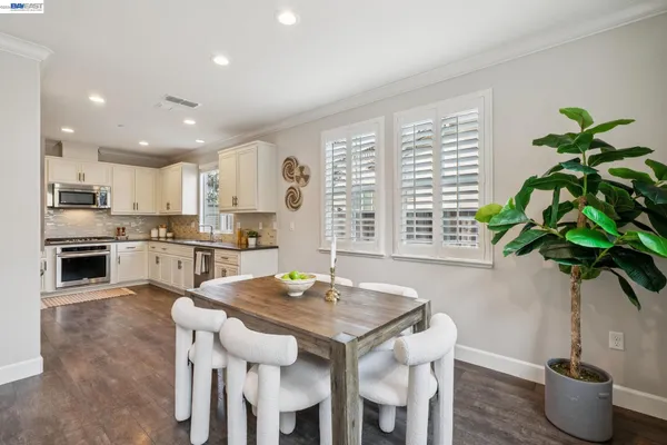 a dining room with furniture and window