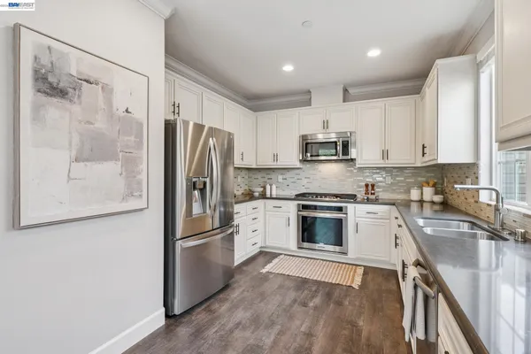 a kitchen with a table and chairs in it