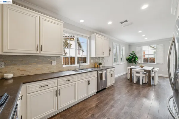 a spacious bedroom that has a bed and a window