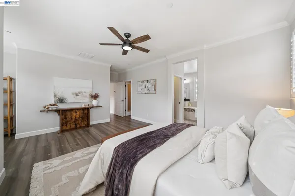 a bathroom with a double vanity sink a mirror and a bathtub