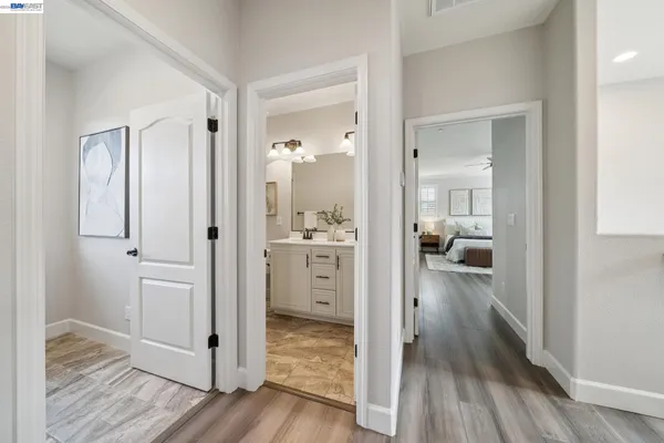 a bathroom with a sink mirror and toilet