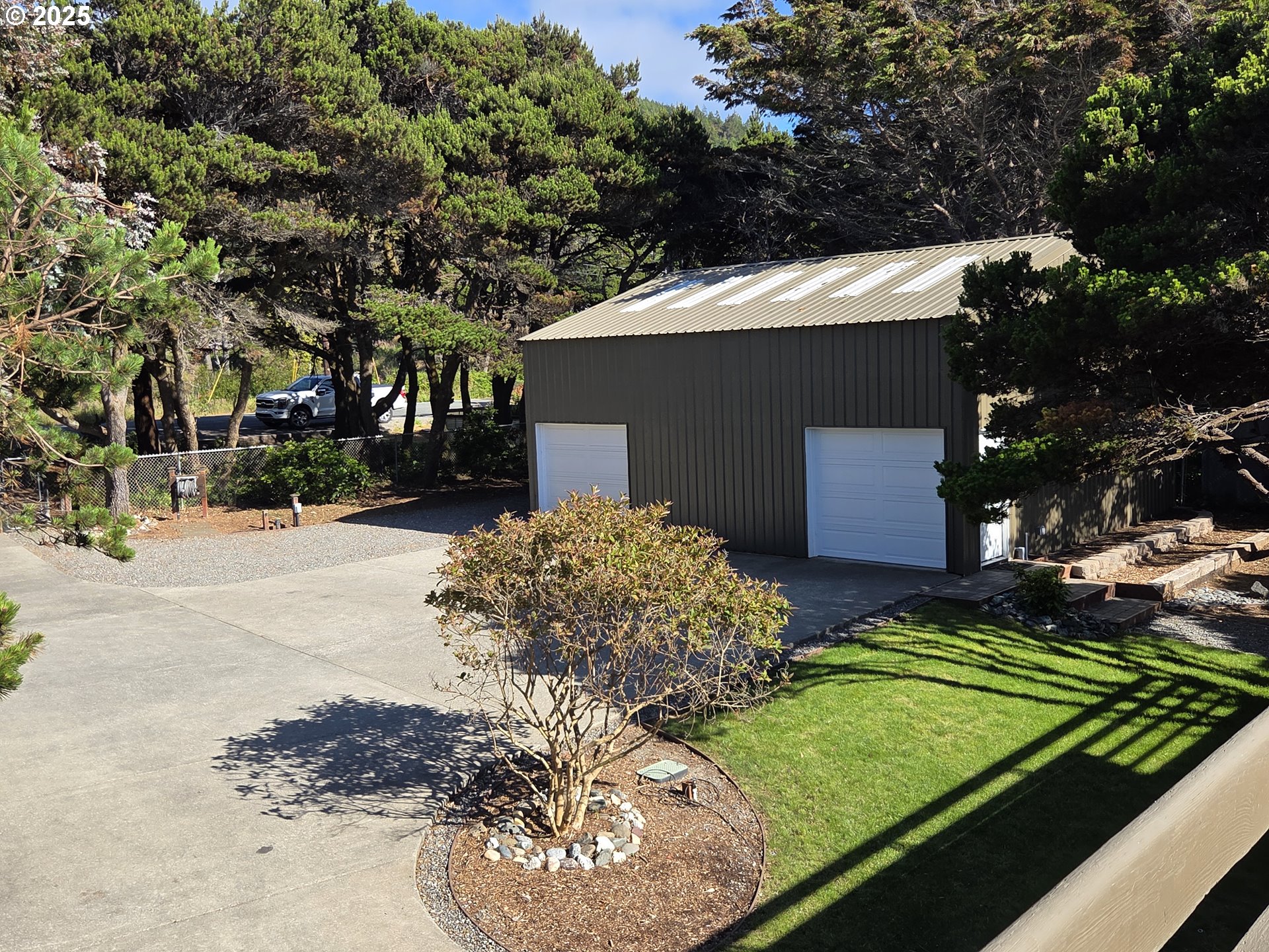 33616 Ophir Road Gold Beach, OR 97444 - Photo 44 of 48 a view of a backyard of the house