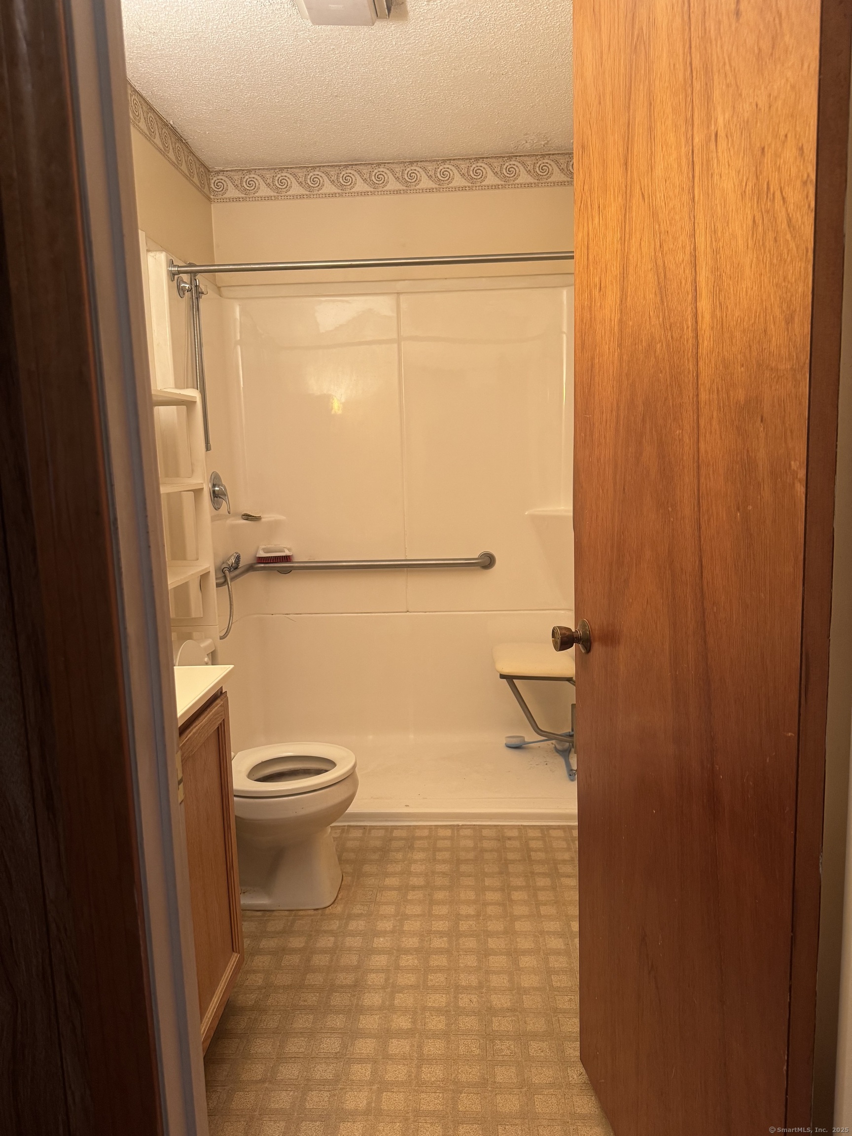 260 Scott Road, Unit 1 Waterbury, CT 06705 - Photo 6 of 11 a bathroom with a toilet and a shower
