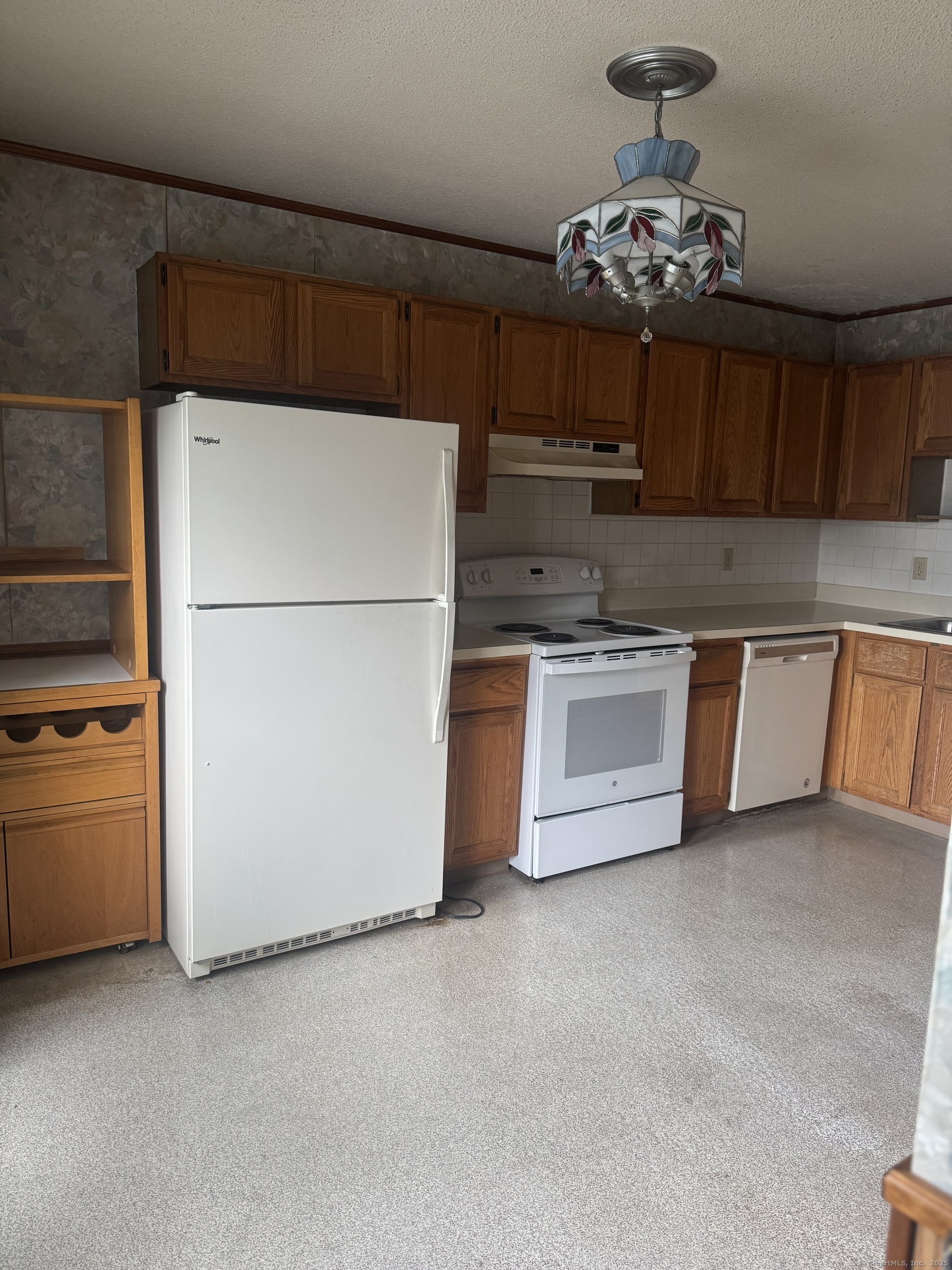 260 Scott Road, Unit 1 Waterbury, CT 06705 - Photo 8 of 11 a kitchen with stainless steel appliances granite countertop a refrigerator a sink dishwasher a stove and a refrigerator