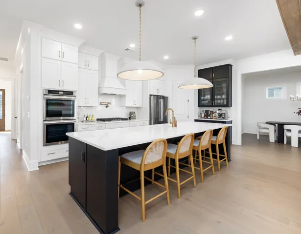a kitchen with appliances and cabinets