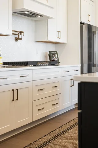 a kitchen with kitchen island a sink a counter and stainless steel appliances