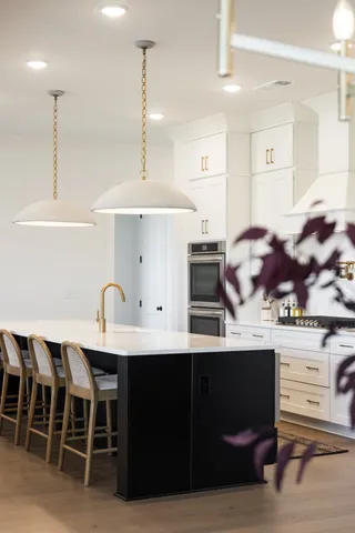 a spacious bedroom with a bed and a ceiling fan
