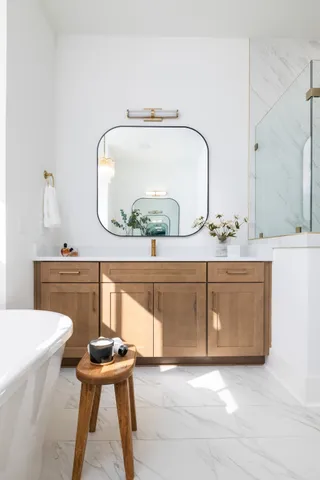 a spacious bedroom with a bed and a couch