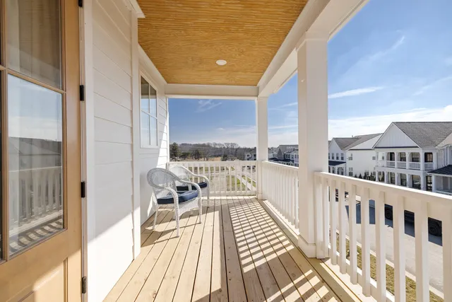 a view of a house with garden and lake view