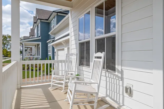 a view of a big room with wooden floor windows and entryway