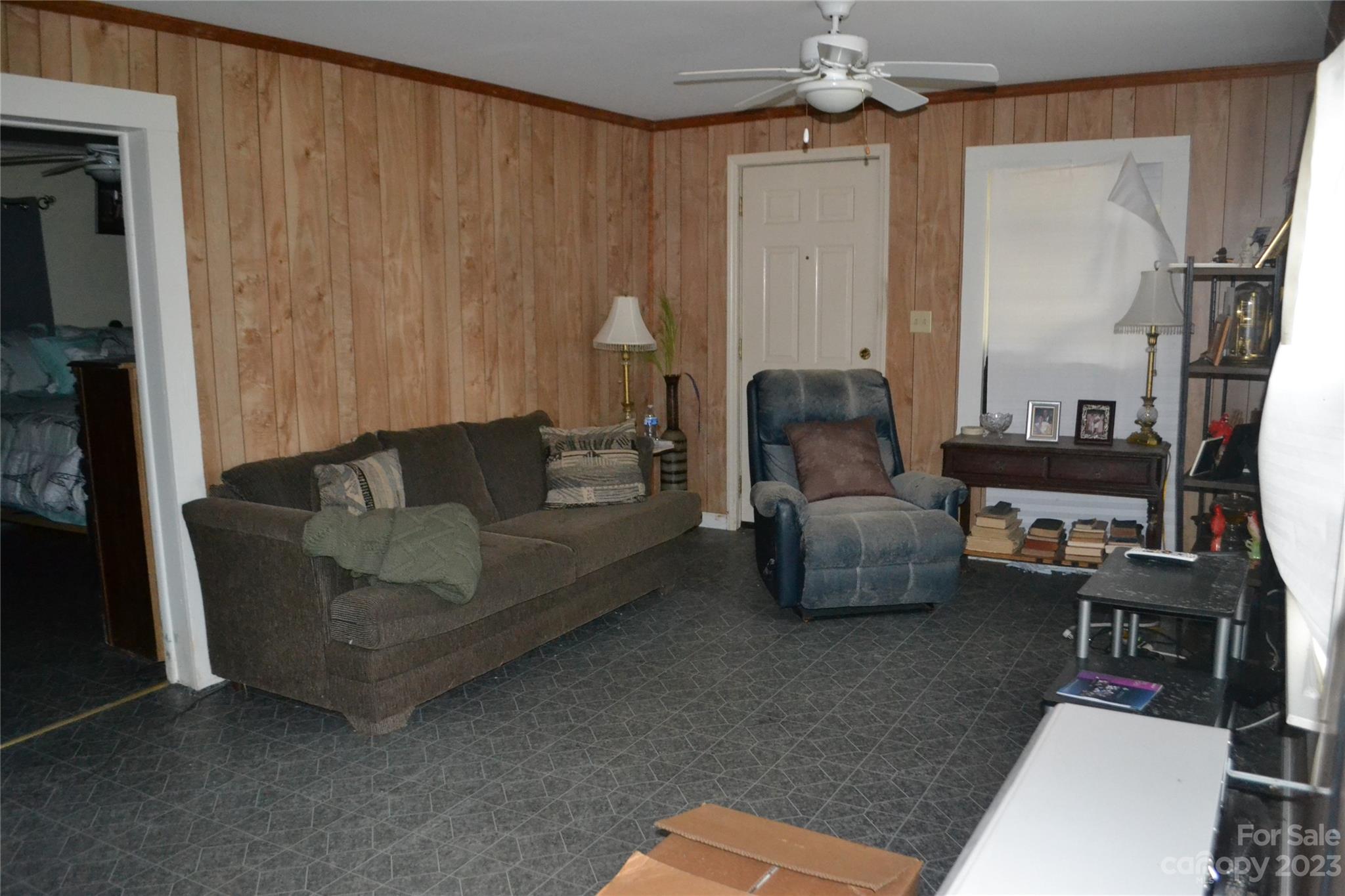 147 Gabriel Street Rutherfordton, NC 28139 - Photo 12 of 29 a living room with furniture and a chandelier