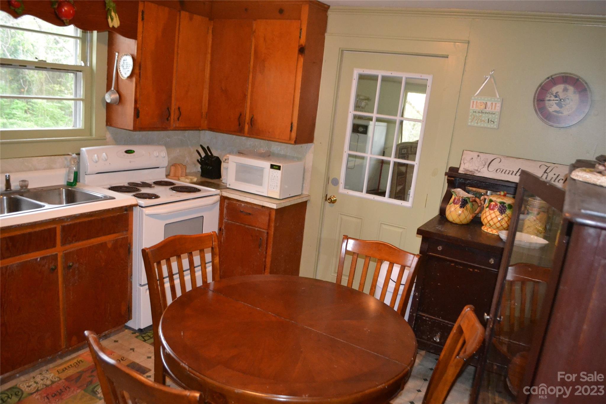 147 Gabriel Street Rutherfordton, NC 28139 - Photo 15 of 29 a view of a dining room with furniture window and wooden floor