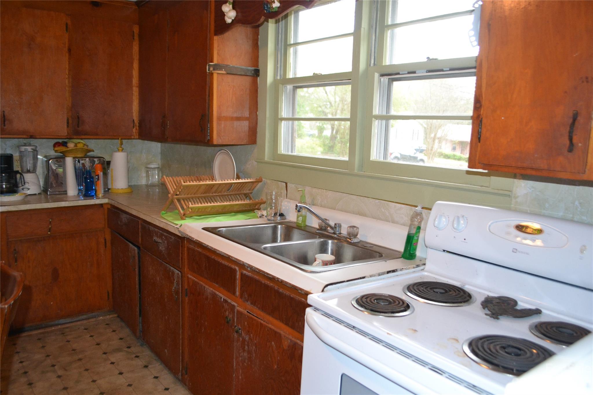 147 Gabriel Street Rutherfordton, NC 28139 - Photo 17 of 29 a kitchen with a sink a stove and a microwave