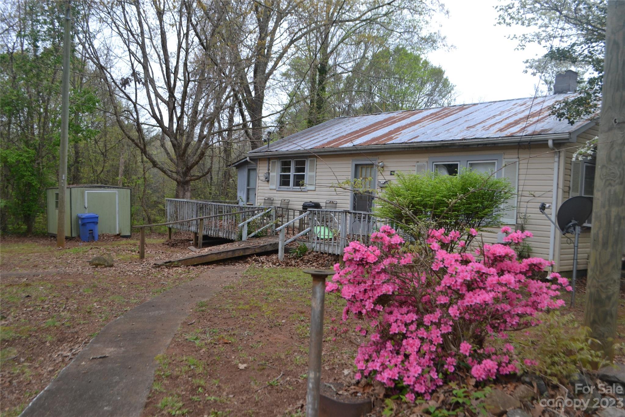 147 Gabriel Street Rutherfordton, NC 28139 - Photo 9 of 29 a view of a house with a backyard and garden