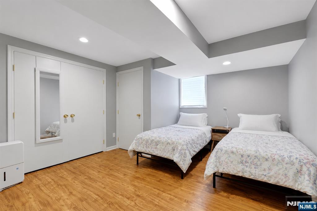 514 Rutland Avenue Teaneck, NJ 07666 - Photo 30 of 40 a bedroom with two beds and painting on the wall