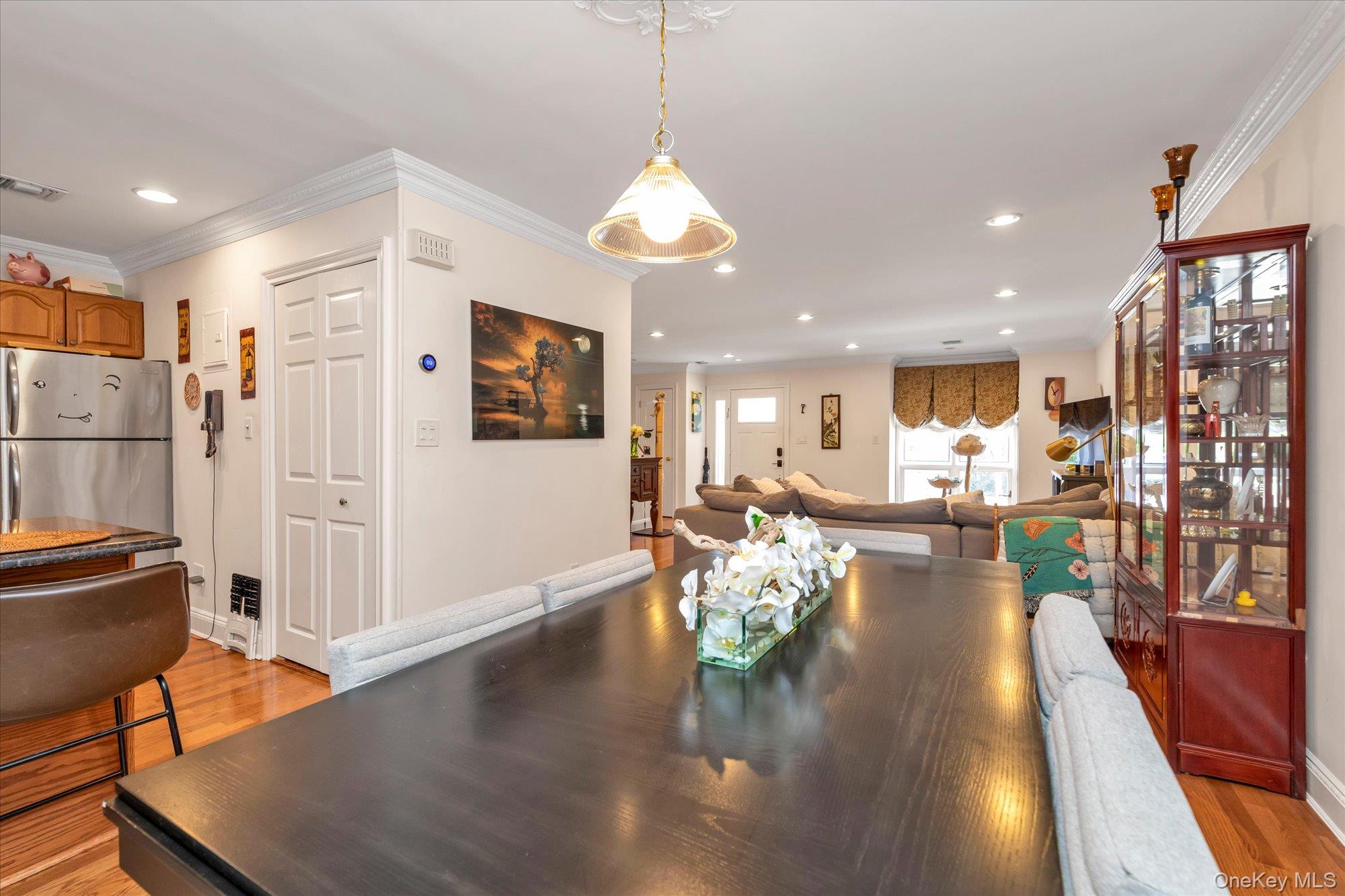 150 I U Willets Road Albertson, NY 11507 - Photo 7 of 21 Open-concept dining room to both peninsula granite kitchen and spacious living room.