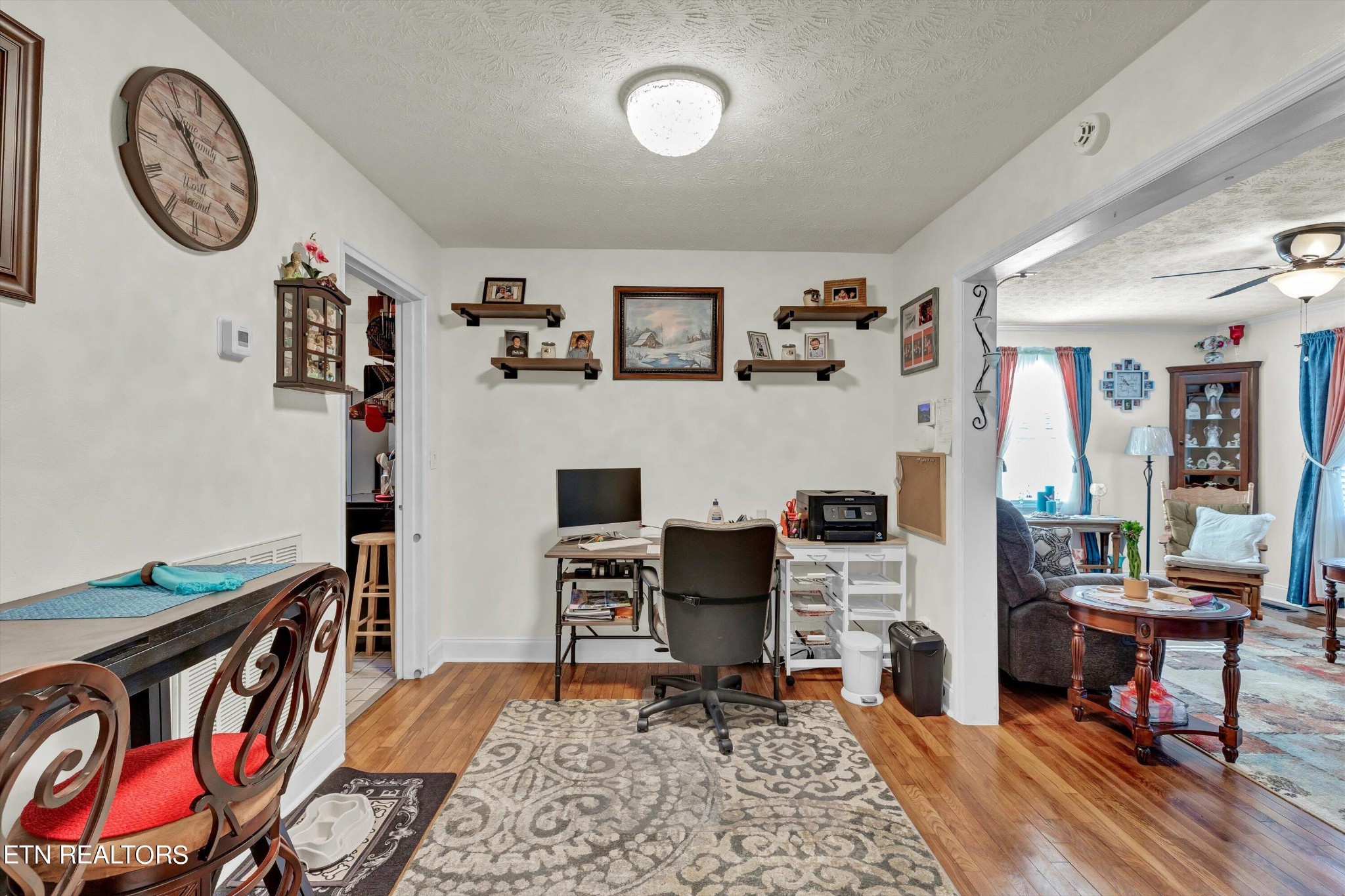 116 Salem Road Oak Ridge, TN 37830 - Photo 9 of 28 a living room with furniture a rug and a wall painting