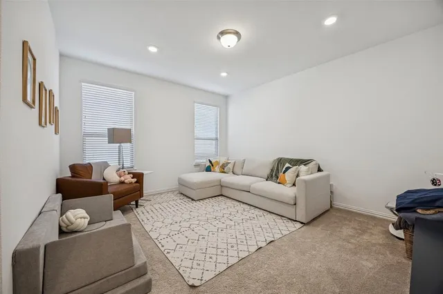 a room with a baby bed baby crib and a dresser