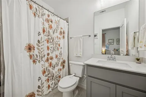 a bed room with a bed and a window