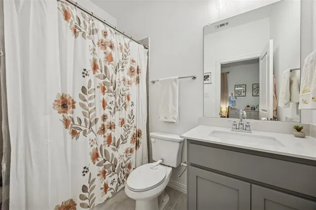 a bed room with a bed and a window