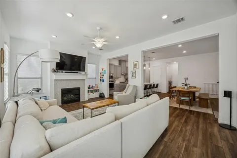 a living room with furniture fireplace and a flat screen tv