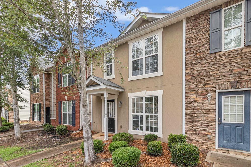 1918 Grove Way Hampton, GA 30228 - Photo 1 of 1 front view of a brick house with a yard