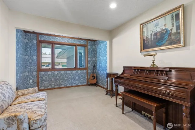 a bedroom with furniture and a window