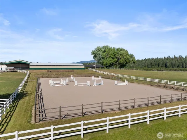a view of a swimming pool with an outdoor seating and yard