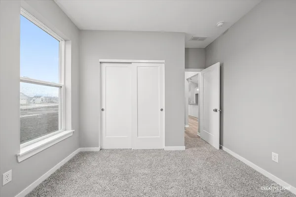 a view of an empty room and window