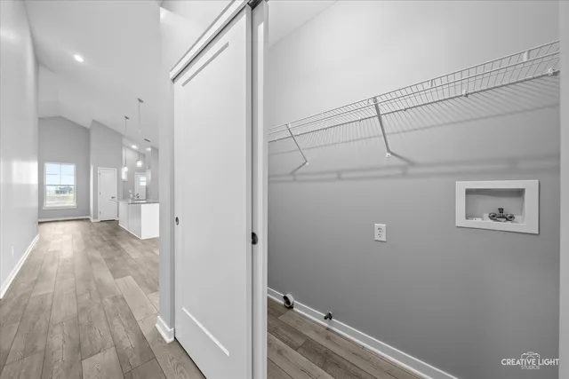 a view of hallway with wooden floor