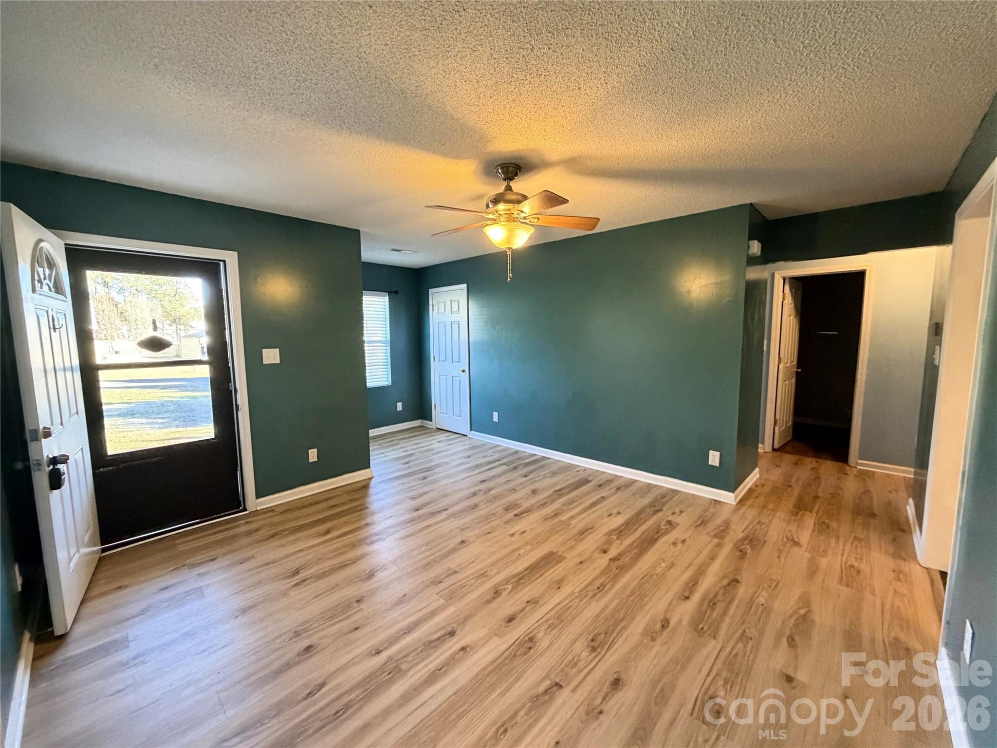 308 Springhill Lane Maiden, NC 28650 - Photo 2 of 21 a view of empty room with wooden floor